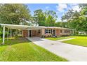 Brick ranch home with carport and spacious yard at 209 Dogwood Dr, Brooksville, FL 34601