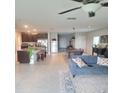 Open kitchen with an island, stainless steel appliances, and a breakfast bar at 14443 Touch Gold Ln, Sun City Center, FL 33573
