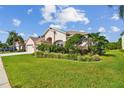 House with manicured lawn, lush landscaping and a two car garage at 5321 Silver Charm Ter, Wesley Chapel, FL 33544