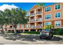 Condo building with parking and lush landscaping at 5000 Culbreath Key Way # 8-208, Tampa, FL 33611