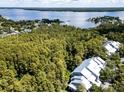 Aerial view of community showcasing lush landscaping and lake views at 2511 Dolly Bay Dr # 301, Palm Harbor, FL 34684