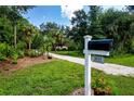 Mailbox at the entrance to a home with a long driveway at 3111 Arrowsmith Rd, Wimauma, FL 33598