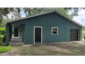 Home with a garage and fenced yard offering a private outdoor space for recreation and relaxation at 8013 N Ola Ave, Tampa, FL 33604