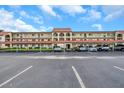 Building exterior with covered parking at 2440 Winding Creek Blvd # 201, Clearwater, FL 33761