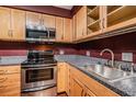 Galley kitchen with stainless steel appliances at 4611 W Fig St # 304, Tampa, FL 33609