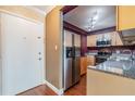 Condo kitchen with stainless steel fridge at 4611 W Fig St # 304, Tampa, FL 33609
