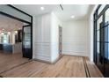 Elegant foyer with white walls and hardwood floors at 3305 W Beaumont St, Tampa, FL 33611