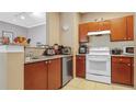 Well-equipped kitchen featuring ample cabinetry and modern appliances at 18001 Richmond Place Dr # 1122, Tampa, FL 33647