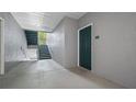 Interior hallway with stairs and apartment entrance at 18001 Richmond Place Dr # 1122, Tampa, FL 33647