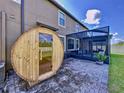 Outdoor barrel sauna with glass door at 11511 Palmetto Pine St, Riverview, FL 33569