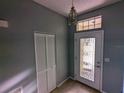 Home entryway with a stained-glass door and closet at 801 Manchester Woods Dr # 38, Sun City Center, FL 33573