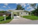 Covered carport with space for two cars and additional storage at 20605 Preston Ln, Lutz, FL 33558