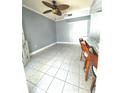 Bright dining area with tile flooring and ceiling fan at 7634 Cortez Ct, Tampa, FL 33615