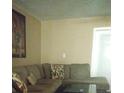 Living Room with sectional sofa and coffee table at 9920 Eagles Point Cir # 2, Port Richey, FL 34668