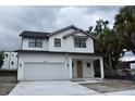 Charming new construction home with two stories, a garage, and a covered front porch at 3204 N Morgan St, Tampa, FL 33603