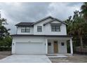 Charming new construction home with two stories, a garage, and a covered front porch at 3204 N Morgan St, Tampa, FL 33603