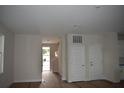 Bright living room featuring sleek doors, neutral walls, and a welcoming entrance at 3204 N Morgan St, Tampa, FL 33603