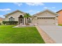 Attractive one-story home with a two-car garage and well-manicured lawn at 19148 Dove Creek Dr, Tampa, FL 33647