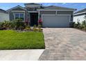 Beautiful single-Gathering home featuring a two-car garage and well-maintained landscaping at 18142 Beach Ranch Ter, Lakewood Ranch, FL 34211