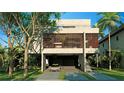 Modern home with concrete exterior and attached garage at 1725 Gulf Rd, Tarpon Springs, FL 34689