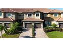 Luxury townhouses with tile roofs and garages at 13506 Messina Loop # 105, Bradenton, FL 34211