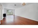 Bright living room with hardwood floors at 4611 W Fig St # 106, Tampa, FL 33609