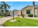 Single-story house with a two car garage and well maintained lawn at 2206 Mayfield Palms Ln # 69, Sun City Center, FL 33573