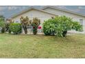 Spacious backyard with patio, lush landscaping, and room for outdoor entertaining at 306 Friar Ct # B, Sun City Center, FL 33573