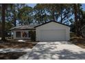 Charming single Gathering home featuring a two-car garage and freshly painted exterior at 1503 N Conrad Ave, Sarasota, FL 34237