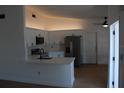 Bright kitchen with quartz countertops, white cabinetry and stainless steel appliances at 1503 N Conrad Ave, Sarasota, FL 34237