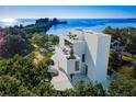 Modern waterfront home with rooftop terrace and infinity pool at 100 Shore Dr, Tarpon Springs, FL 34689