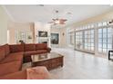 Bright living room featuring a fireplace and French doors leading to patio at 6527 Stonington Dr, Tampa, FL 33647