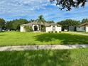 One-story house with a landscaped yard at 12384 Creek Edge Dr, Riverview, FL 33579