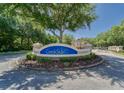Creekside community entrance with lush landscaping at 12384 Creek Edge Dr, Riverview, FL 33579