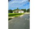 One-story home with a large driveway at 12384 Creek Edge Dr, Riverview, FL 33579