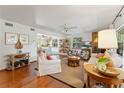 Cozy living room with hardwood floors and fireplace at 29249 Wilpayne Rd, Brooksville, FL 34602