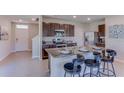 Kitchen with granite island and stainless steel appliances at 3447 Hilltop Cir, Lakewood Ranch, FL 34211