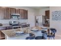 Kitchen with granite countertops and stainless steel appliances at 3447 Hilltop Cir, Lakewood Ranch, FL 34211