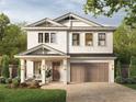 Two-story house with a two-car garage and porch at 815 W Braddock St, Tampa, FL 33603