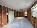 Spacious living room under renovation with exposed framing and natural light at 5150 Chancellor Ne St, St Petersburg, FL 33703