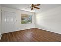 Bright living room with wood-look floors and access to the backyard at 9149 109Th Ter, Seminole, FL 33777