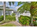 Landscaped front yard with walkway leading to the home entrance at 902 Mcdaniel St # 1, Sun City Center, FL 33573
