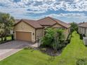 Attractive single-story home with tile roof and landscaped yard at 5243 Esplanade Blvd, Bradenton, FL 34211