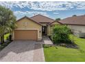 Attractive single-story home with tile roof and landscaped yard at 5243 Esplanade Blvd, Bradenton, FL 34211