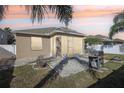 Screened patio, grill, firepit, and brick pavers at 7720 Rathdown Ln, Wesley Chapel, FL 33545