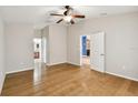 Spacious bedroom with wood flooring and access to bathroom at 6843 Runner Oak Dr, Wesley Chapel, FL 33545