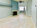 Living room with fireplace and tiled floors at 10425 La Mirage Ct # 202, Tampa, FL 33615