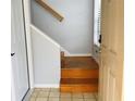 View of stairs leading to the upper level of the home at 10425 La Mirage Ct # 202, Tampa, FL 33615
