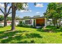 Quaint house exterior, nicely landscaped yard at 301 N Glen Ave, Tampa, FL 33609
