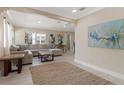 Sunlit living room with a large sectional sofa and stylish decor at 609 N Osceola Ave, Clearwater, FL 33755